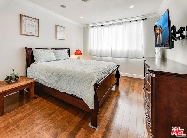 bedroom featuring dark hardwood / wood-style flooring and crown molding