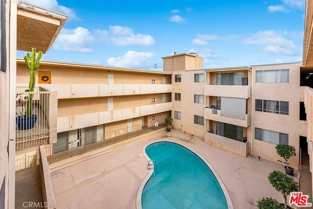 view of pool featuring a patio