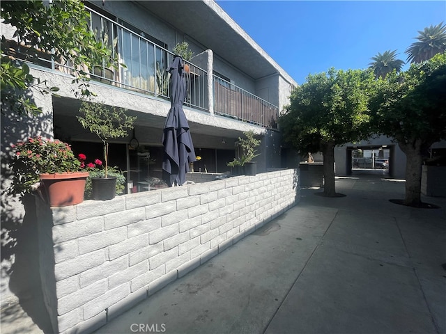 exterior space with a gazebo and a balcony