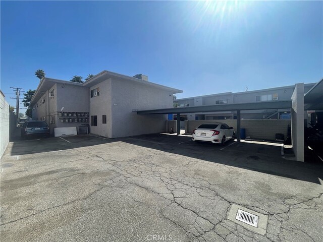 exterior space with a carport