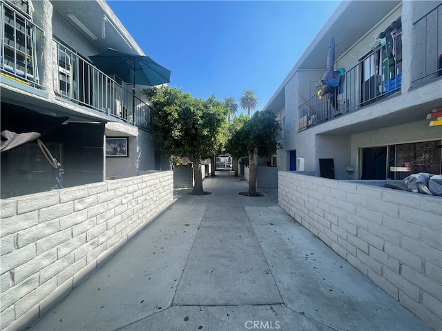 view of side of home with a balcony