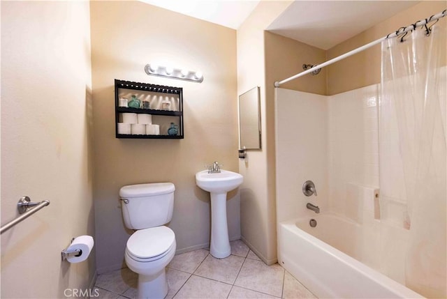 bathroom featuring tile patterned flooring, shower / tub combo, and toilet