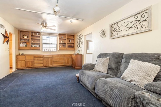 carpeted living room featuring ceiling fan and rail lighting