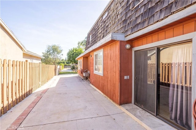 view of property exterior featuring a patio area