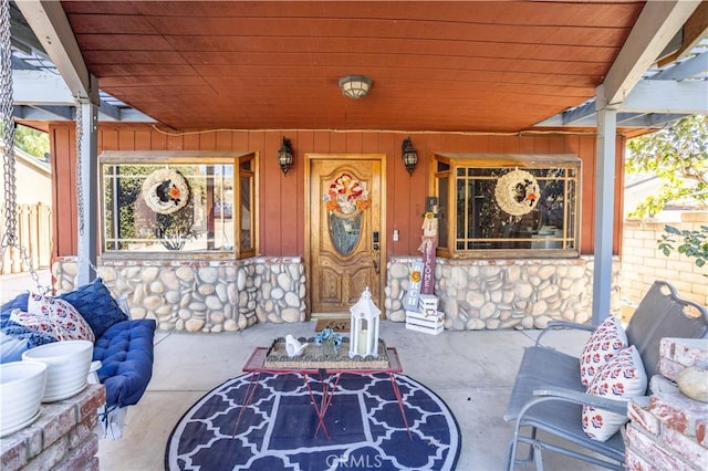 entrance to property with covered porch