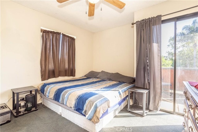 carpeted bedroom featuring access to exterior and ceiling fan