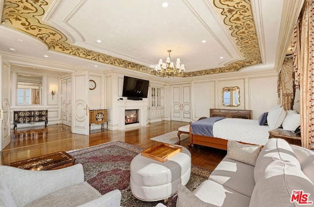 bedroom with crown molding, dark hardwood / wood-style floors, and an inviting chandelier