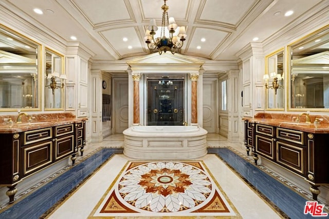 bathroom with vanity, a notable chandelier, and ornamental molding