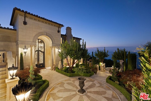 view of patio terrace at dusk