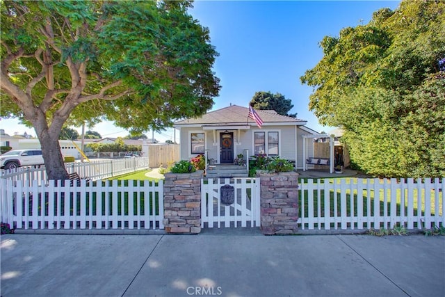 view of front of house with covered porch and a front yard