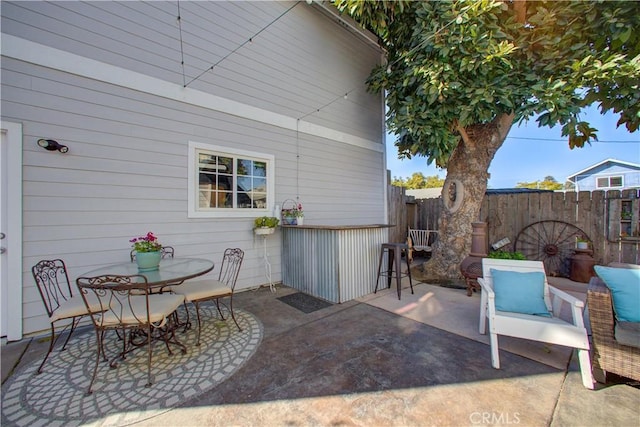 view of patio / terrace featuring an outdoor bar