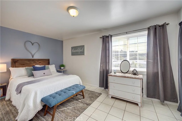 bedroom with light tile patterned flooring