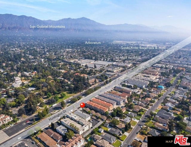 drone / aerial view featuring a mountain view