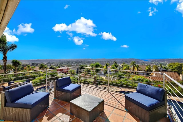 view of patio featuring a balcony and an outdoor hangout area