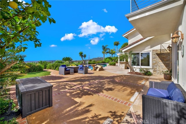 view of patio / terrace with outdoor lounge area and an outdoor pool