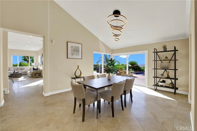 dining room with high vaulted ceiling, light tile patterned flooring, a wealth of natural light, and baseboards