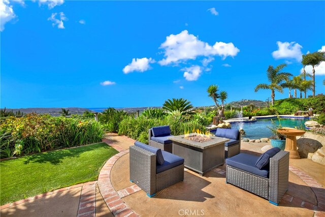 view of patio featuring a fire pit