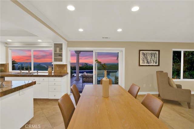 dining area featuring light tile patterned floors, a wealth of natural light, visible vents, and recessed lighting