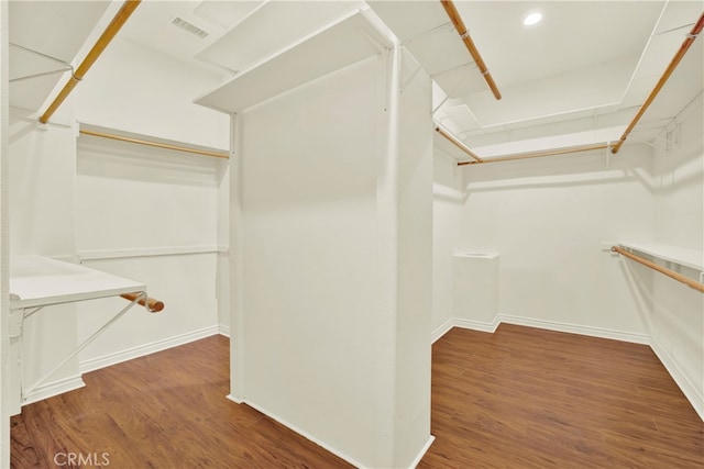 spacious closet with visible vents and wood finished floors