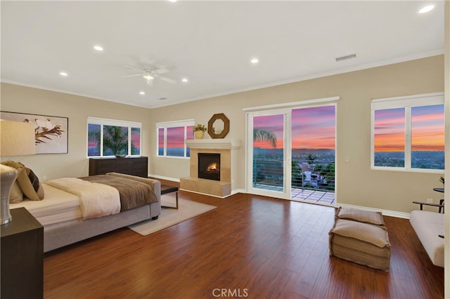 bedroom with access to exterior, visible vents, ornamental molding, and wood finished floors