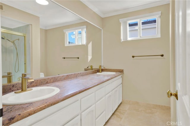 full bath with crown molding, a stall shower, and a sink