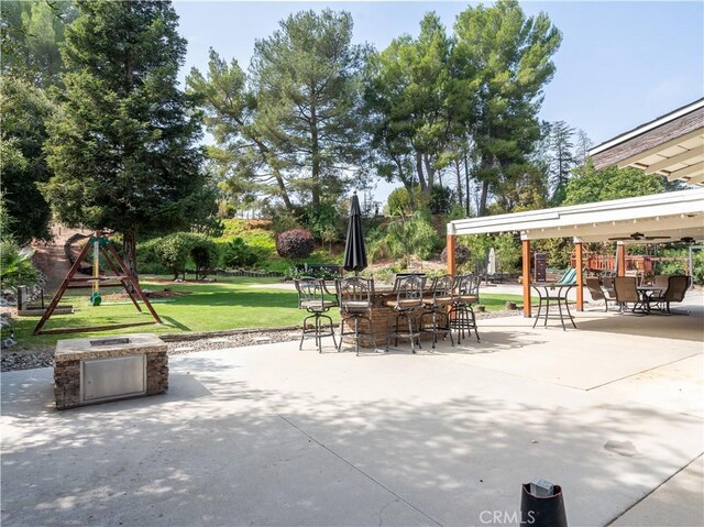 view of patio featuring a playground