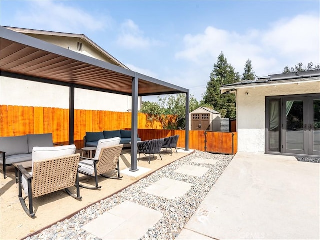 view of patio / terrace with an outdoor hangout area and a storage unit