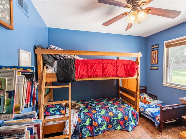 bedroom featuring hardwood / wood-style floors and ceiling fan