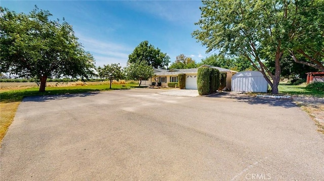 ranch-style home featuring a garage