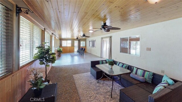 sunroom featuring wood ceiling