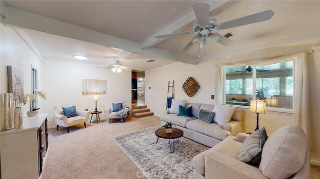 565 5th Ave, Orland, CA 95963 - living area with ceiling fan, baseboards, beamed ceiling, carpet flooring, and stairs