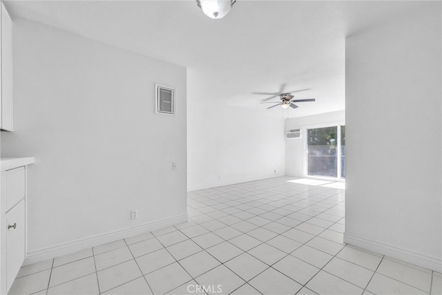 spare room featuring light tile patterned floors and ceiling fan