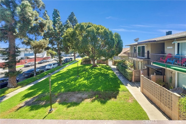 view of yard featuring a balcony