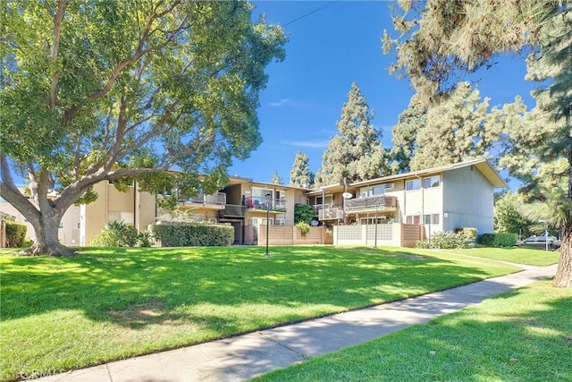 view of community featuring a yard