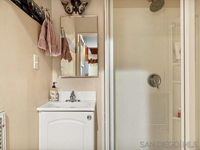 bathroom with vanity and walk in shower