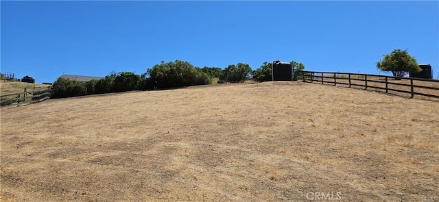 view of yard with a rural view