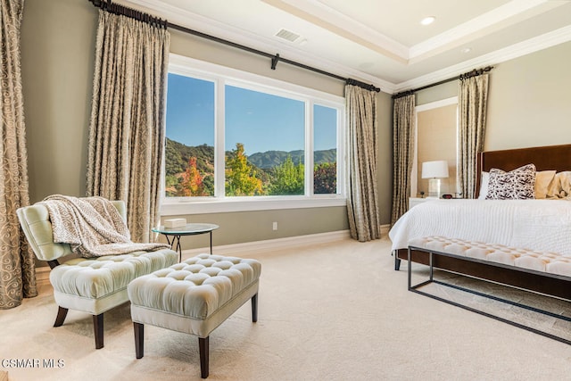 carpeted bedroom featuring crown molding, a mountain view, and a tray ceiling