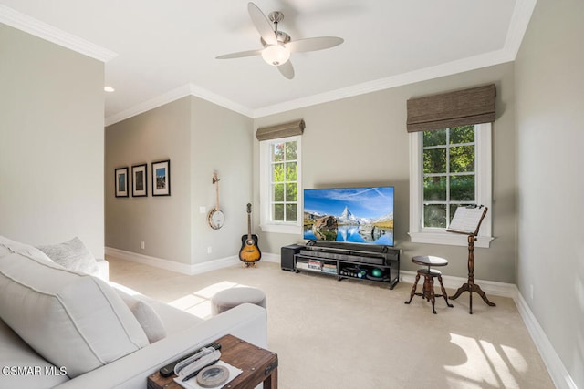 carpeted living room featuring ceiling fan and crown molding