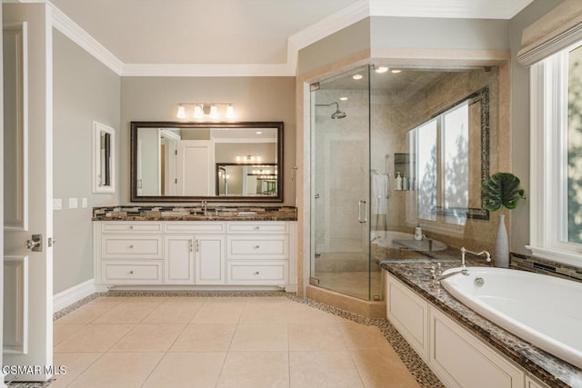 bathroom with shower with separate bathtub, a healthy amount of sunlight, vanity, and tile patterned flooring