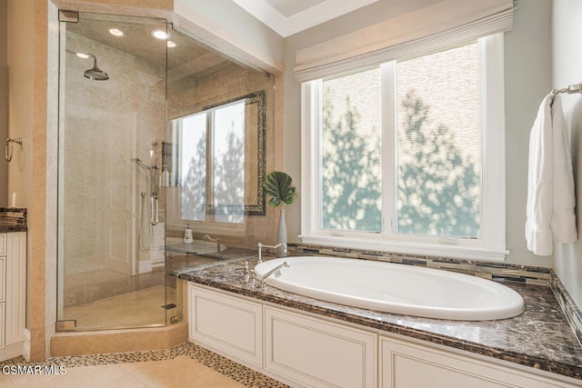 bathroom featuring vanity, tile patterned floors, crown molding, and plus walk in shower