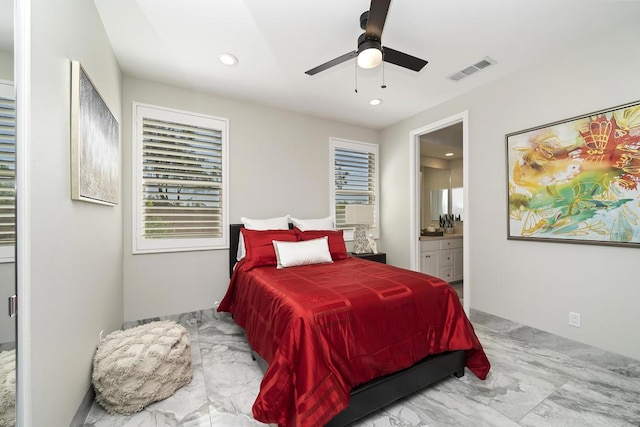 bedroom with ensuite bathroom and ceiling fan