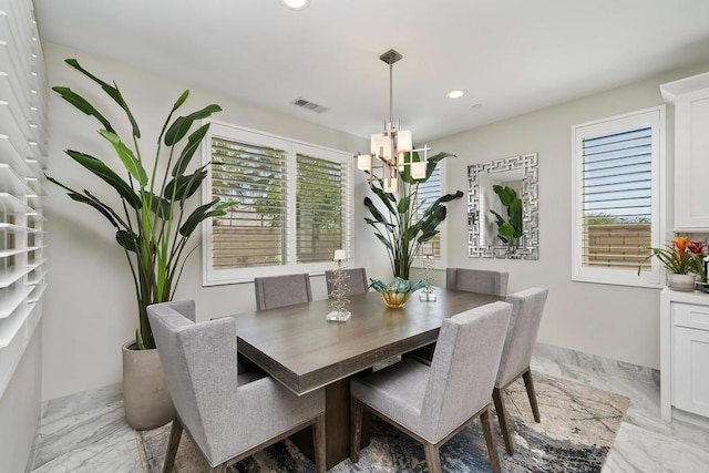 dining room with a notable chandelier