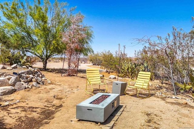 view of yard with an outdoor fire pit