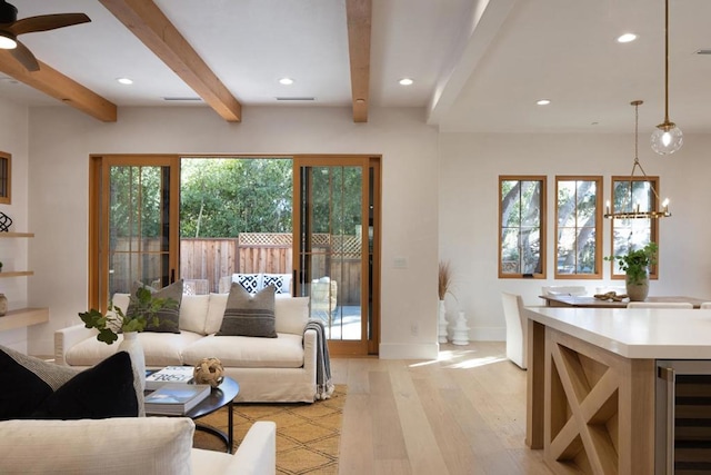 living room with ceiling fan, light hardwood / wood-style flooring, beamed ceiling, and beverage cooler