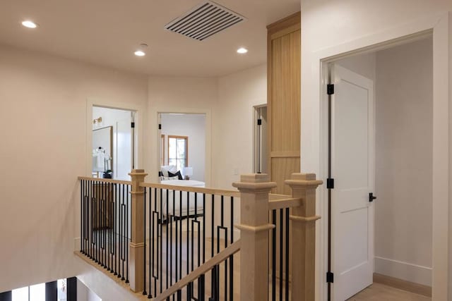 corridor with light hardwood / wood-style flooring