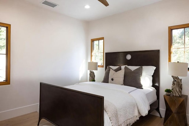 bedroom featuring ceiling fan and wood-type flooring