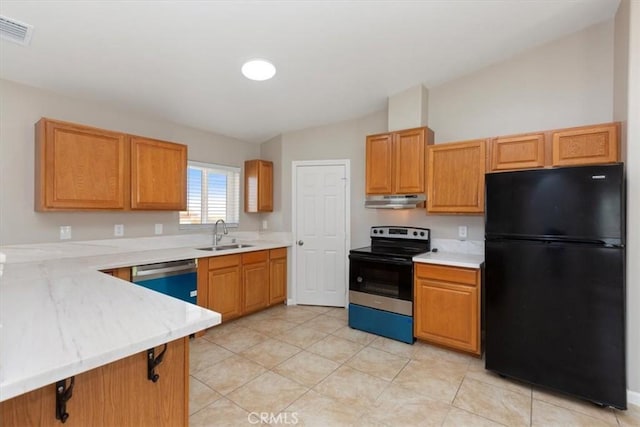 kitchen with sink, light tile patterned floors, vaulted ceiling, and appliances with stainless steel finishes