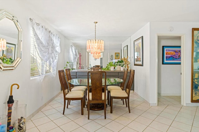 dining area featuring light tile patterned floors and a chandelier