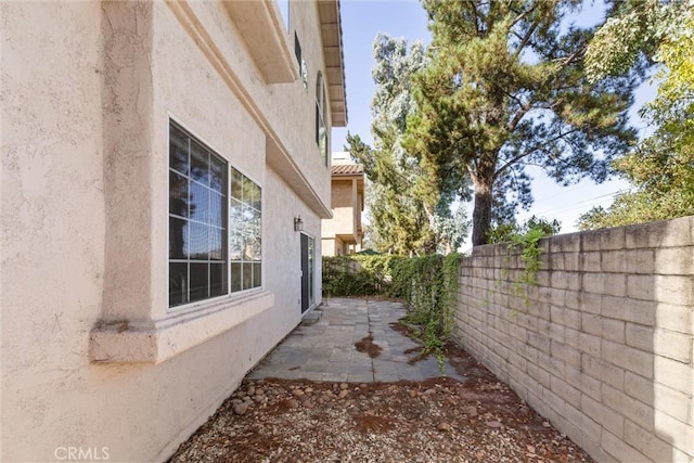 view of property exterior featuring a patio area