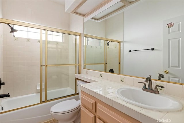 full bathroom featuring vanity, toilet, and enclosed tub / shower combo